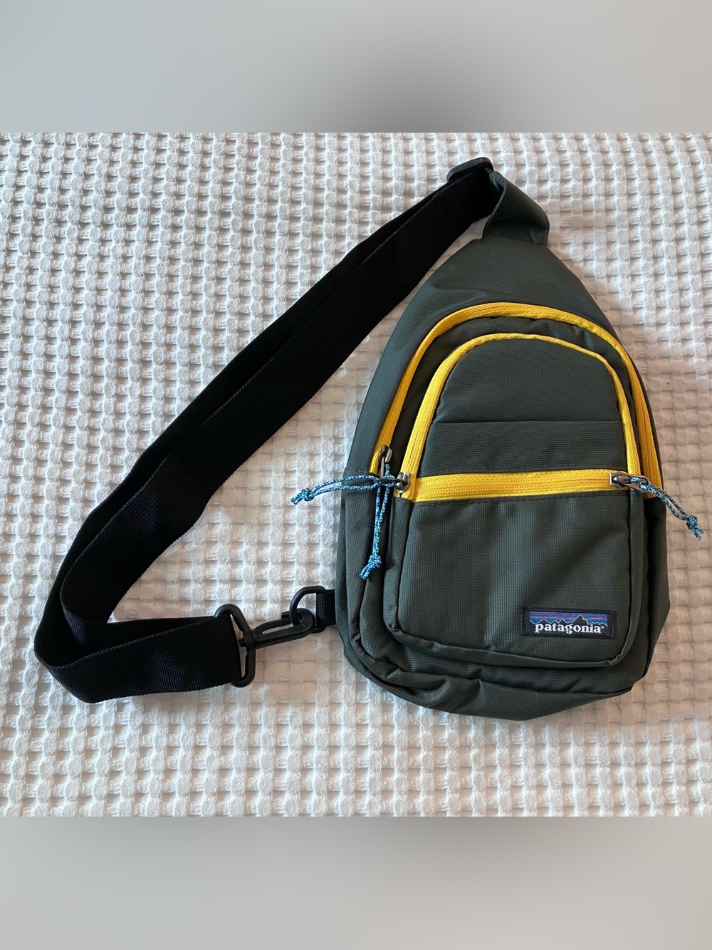 Patagonia Green Sling Bag with Yellow Zippers